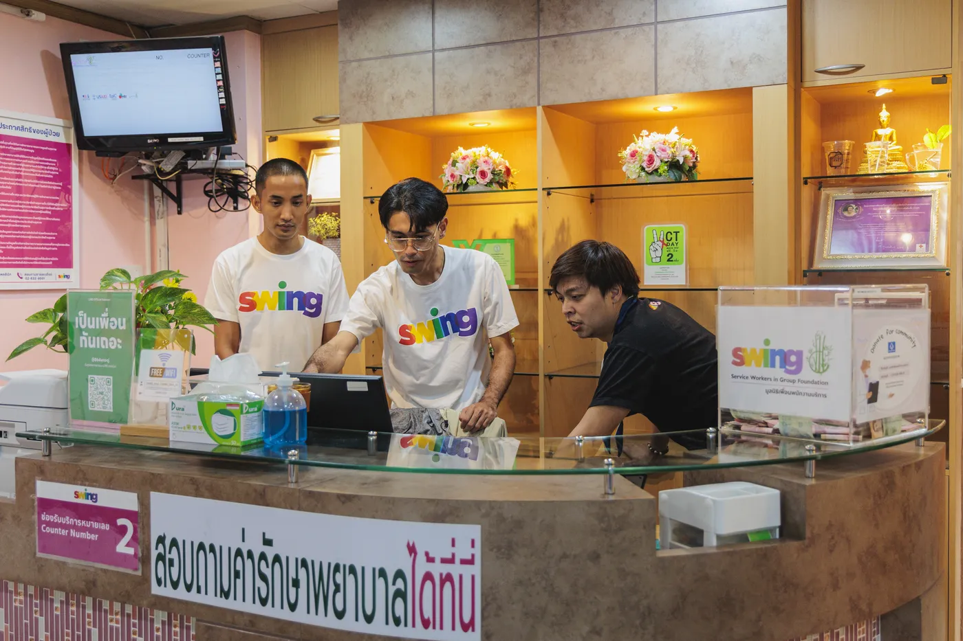 SWING staff at the clinic counter